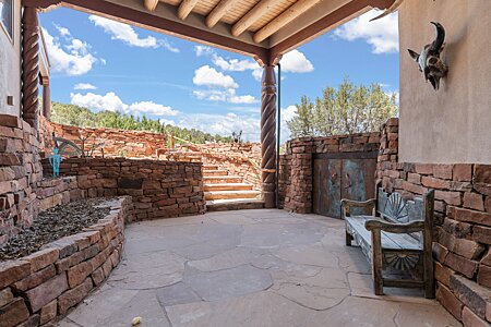 Front grand entry with flagstone and artistic touches