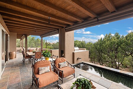Expansive portal with a handsome fountain and sunset views- plenty of room for a party!