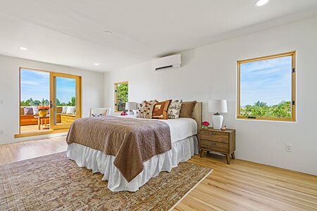 Bedroom of the Primary Suite accesses a Private View Deck