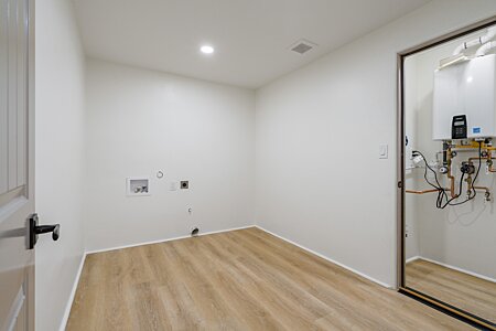 Lower-level Laundry Room, plumbed for Washer and Dryer