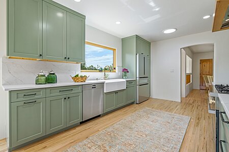 ...Quartz Countertops and Single-basin Under-mounted Farmhouse-style Sink