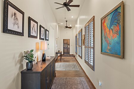 Main Hallway with several windows & expansive walls for art, on the way to Bedrooms 2 & 3