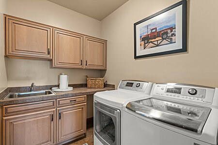 Laundry room with sink & cabinets for storage