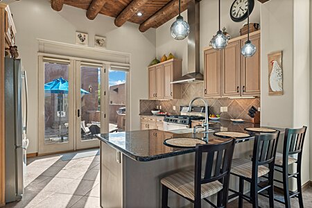 Kitchen counter has space for socializing with guests