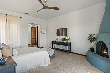 Master Bedroom with Kiva Fireplace, looking to the Master Bath