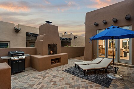 West Courtyard with Fireplace, showing access off the Kitchen