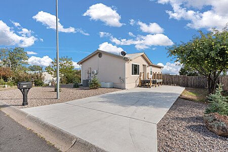 Spacious Lot with a New Coyote Fence and a Producing Apple Tree!