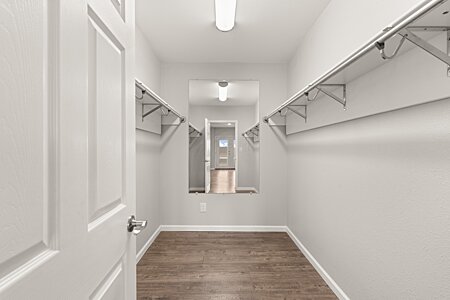 Sizable Walk-in Closet in Lower Level Primary Bedroom