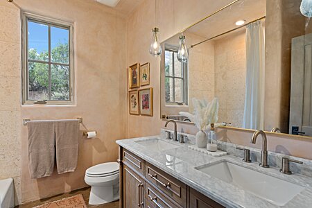 Guest wing marble bathroom filled with sunshine and beauty!