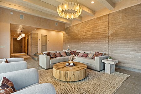 DIVINE rammed earth walls in this living area.